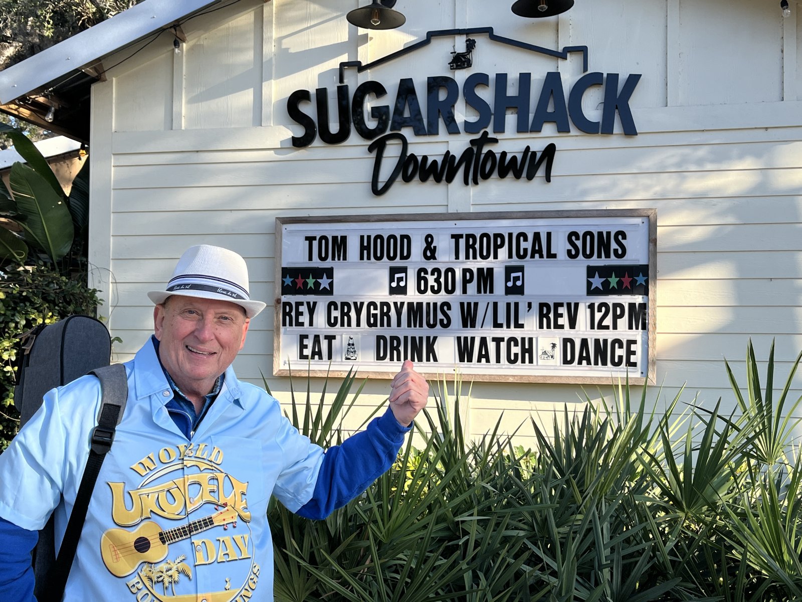 Tom Hood in front of the Sugar Shack Downtown marquee